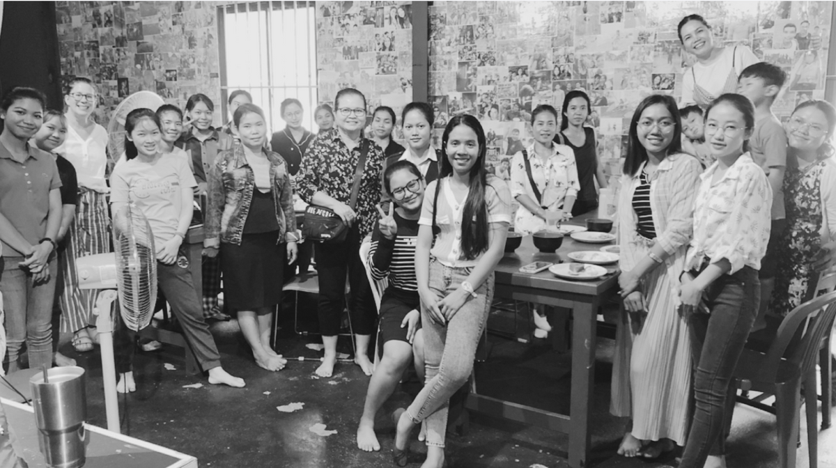 group photo of young girls posing at camera and smiling.