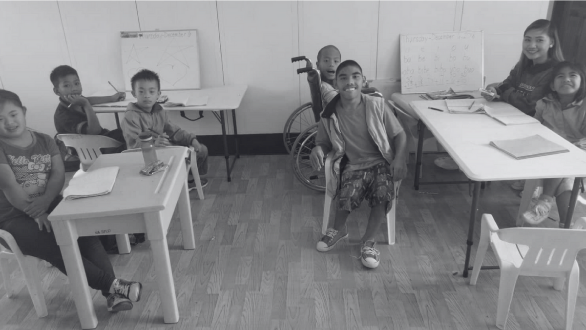 black and white photo of students in classroom.